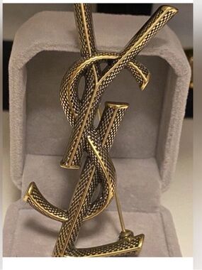 Yves Saint Laurent Antique Gold
Tone Cassandre Monogram
Snake Pin Brooch Unisex